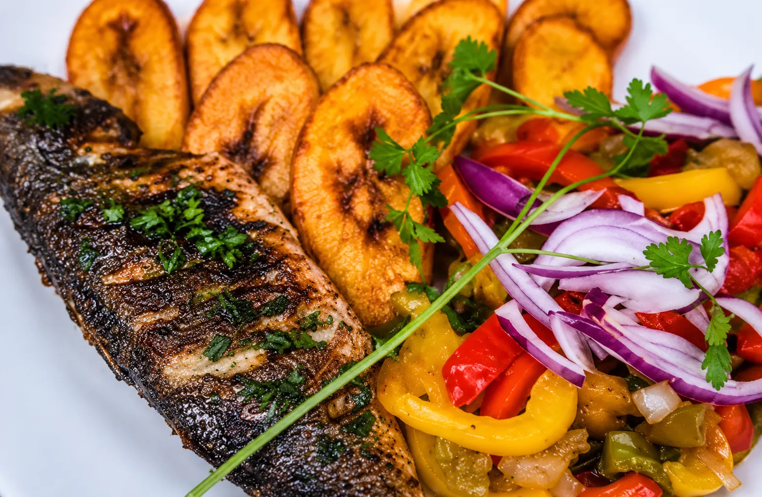 Grilled fish served by Mami Maggie's Recipes, Cameroonian catering in Newport
