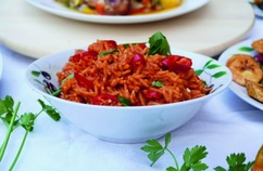 Bowl of Cameroonian jollof rice, rich and smoky, served by Mami Maggie's Recipes in Newport